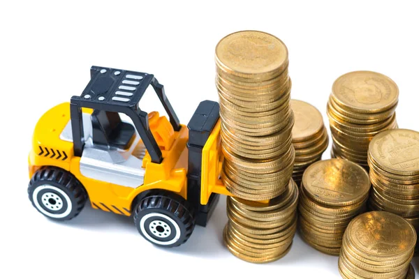 Mini forklift truck loading stack coin with steps of gold coin, Royalty Free Stock Photos