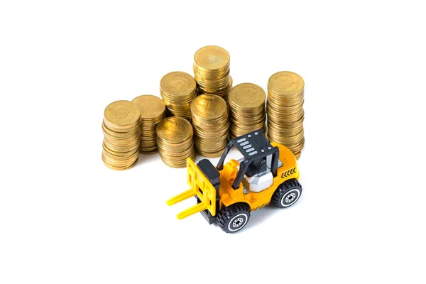 Mini-Gabelstapler belädt Münze mit Goldmünze, — Stockfoto