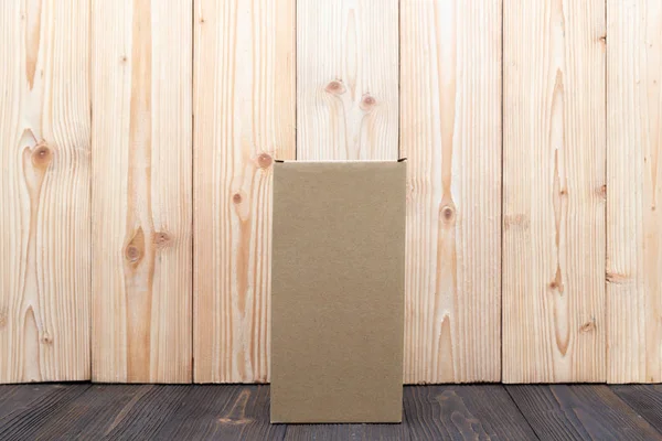Empty Package brown cardboard box or tray on wooden background, — Stock Photo, Image