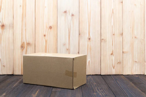 Empty Package brown cardboard box or tray on wooden background, — Stock Photo, Image