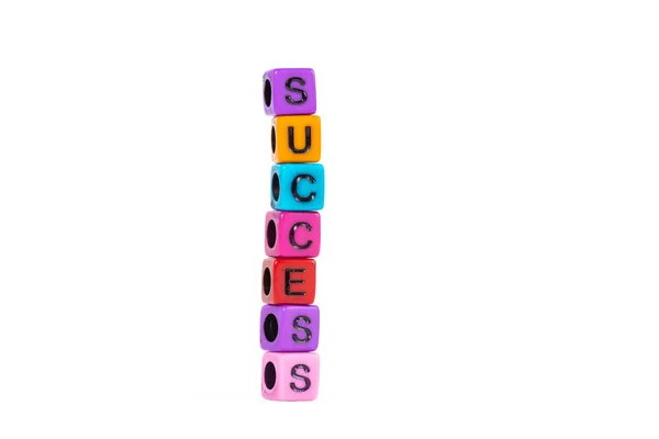 Siker szöveg készült színes gyöngyök, vagy levelet a gyöngy a fehér ba — Stock Fotó
