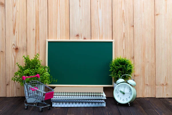 Blank green chalkborad and little tree with vintage alarm clock — Stock Photo, Image