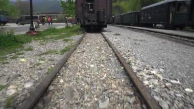 walking along the retro train, Old steam locomotive close-up, Steam narrow gauge train, Steam train chugging through the countryside, narrow-gauge railway