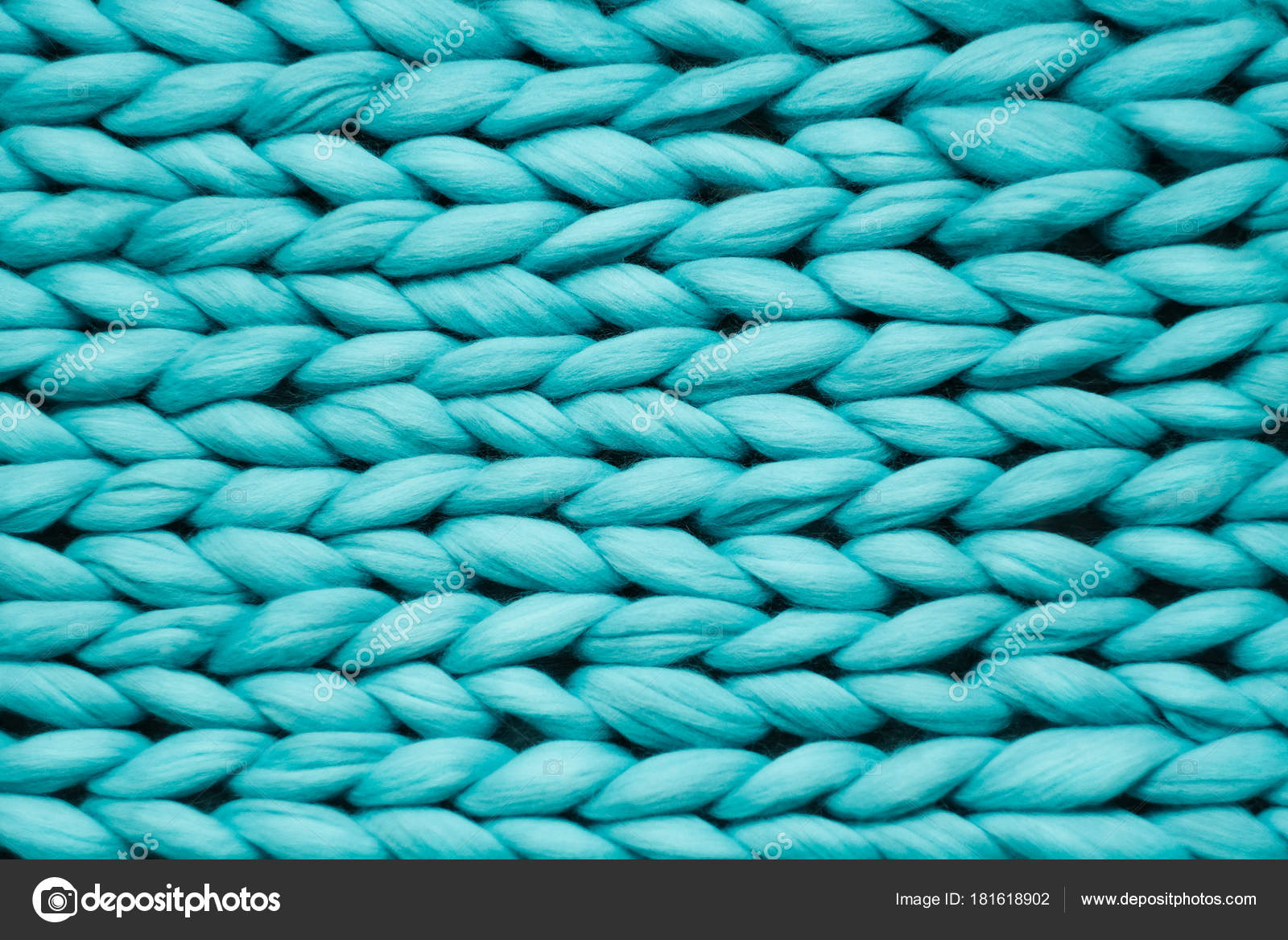 Texture of blue knit blanket. Large knitting. Plaid merino wool. Top