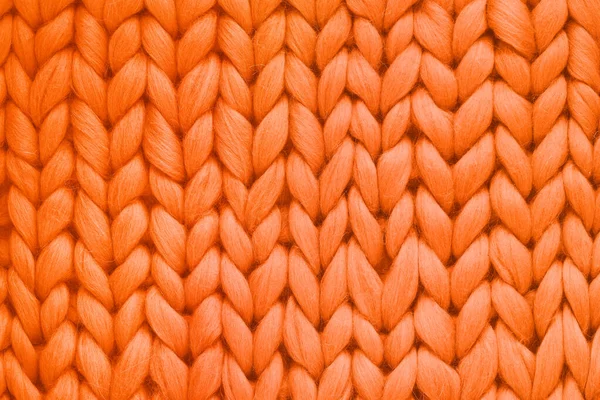 Textur der orangefarbenen Wolle große Strickdecke. Großstricken. karierte Merinowolle. Ansicht von oben — Stockfoto