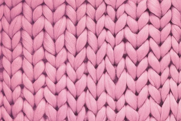 Textur aus rosa Wolle große Strickdecke. Großstricken. karierte Merinowolle. Ansicht von oben — Stockfoto
