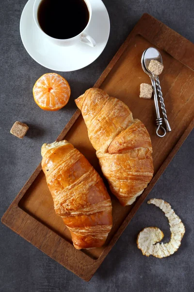Two fresh croissants and cup of coffee — Stock Photo, Image