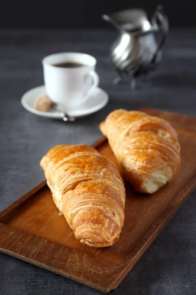 Two fresh croissants and cup of coffee — Stock Photo, Image