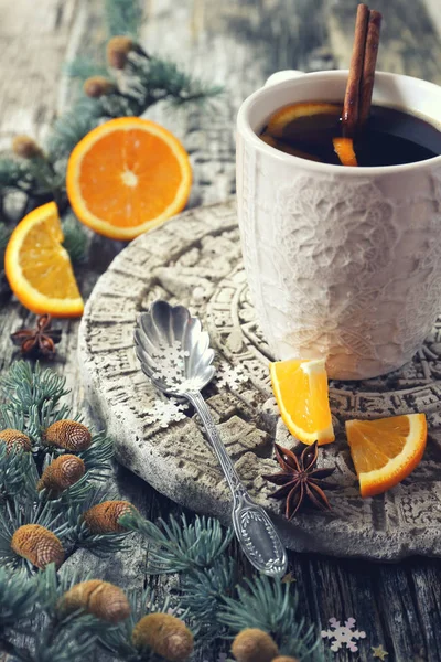 Winter hot beverage with cinnamon and orange — Stock Photo, Image
