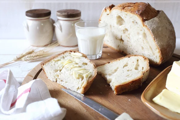 French sourdough bread, butter and glass of milk — Stock Photo, Image