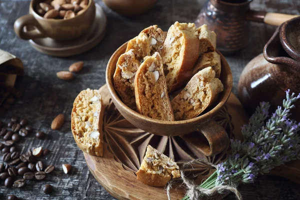 Italian cookies: almond and lavender cantuccini on wooden background. Focus selective
