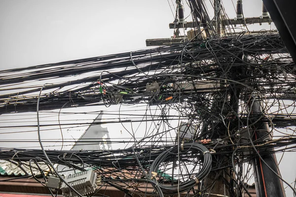 Electic cables mess at the streets of Phuket, Thailand.