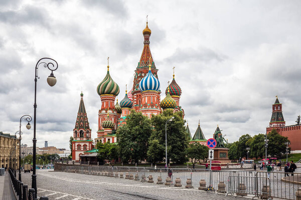 Kremlin and St Basil's Cathedral on the Red Square in Moscow in summer. Kremlin is one of the main travel attractions in Europe. UNESCO site. Moscow, Russia - August 06 2019.
