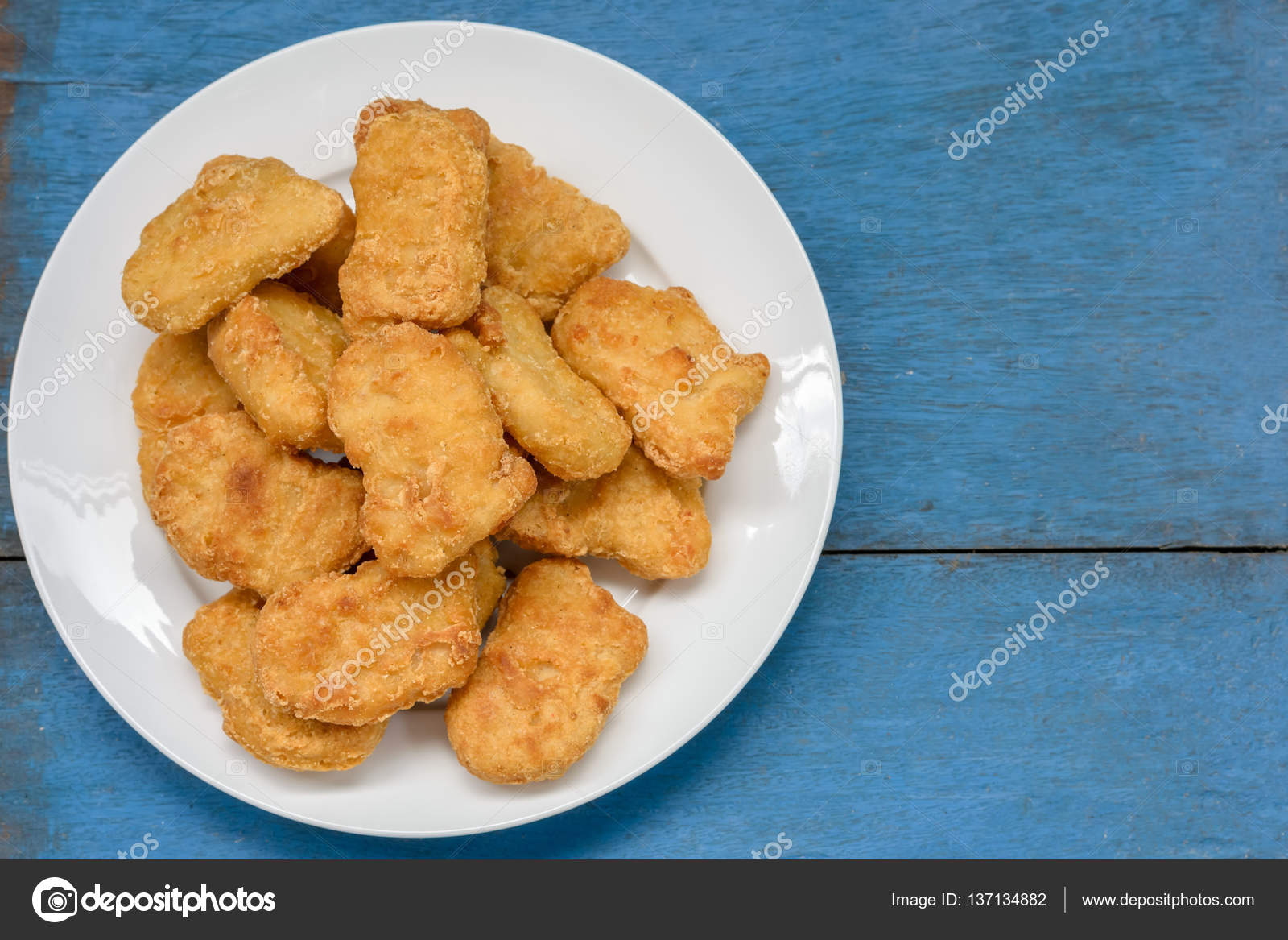 Chicken nuggets on the wooden vintage background Stock Photo by  ©Aon_skynotlimit 137134882