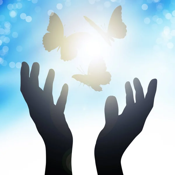 Hands reach to the sun, releasing butterflies — Stock Photo, Image