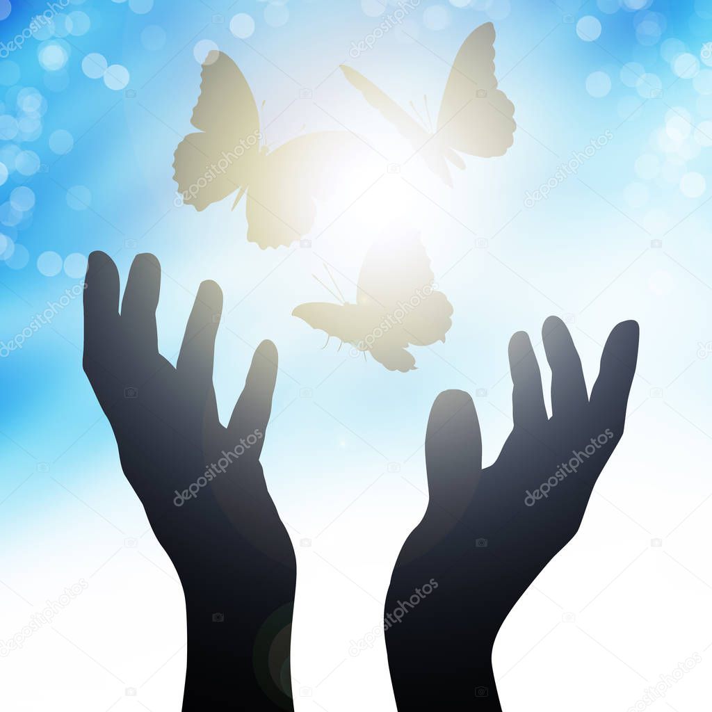 hands reach to the sun, releasing butterflies