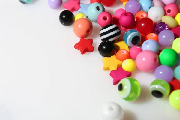 Colorful beads on white background — Stock Photo, Image