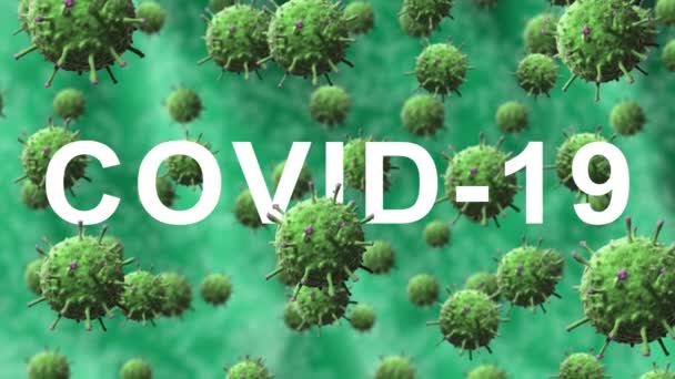 Надпись covid-19 появляется гладко на фоне зеленых бактерий или вирусов, клетки движутся медленно и вращаются — стоковое видео