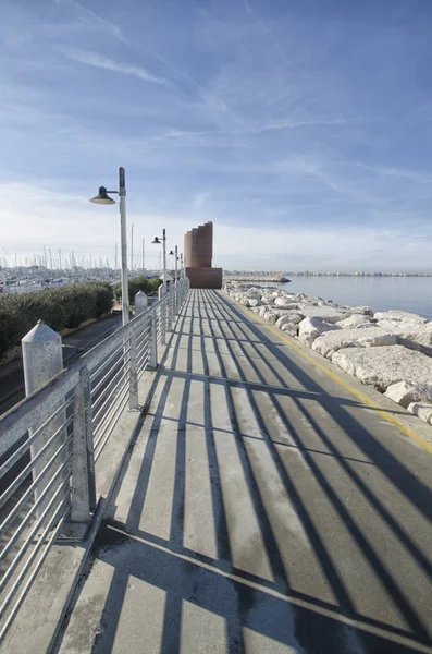 The walkway of the marina of Римини — стоковое фото