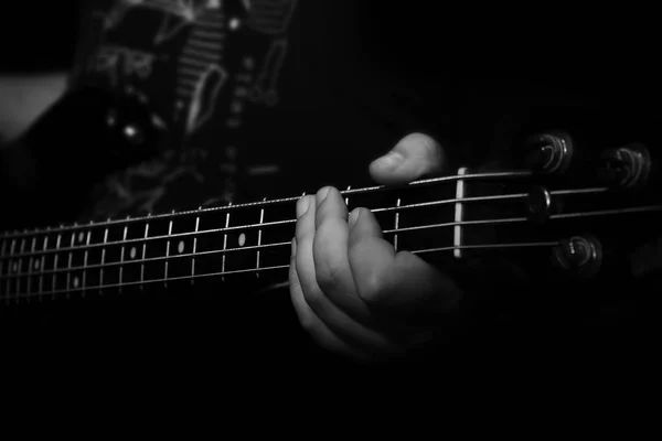 Bass Guitar Player Playing Bass in Music Studio