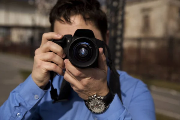 Photographer Photographing Outdoors Shooting Urban City Environment Stock Image