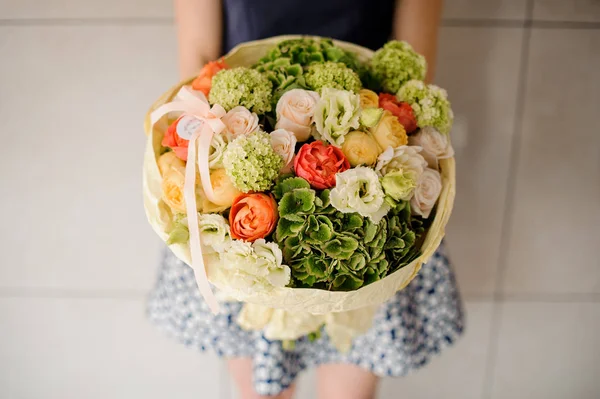 An interesting bouquet in the hands of a girl — Stock Photo, Image