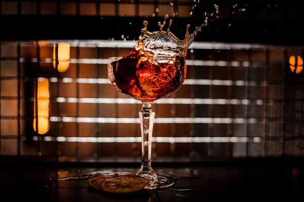 Splash cocktail on a dark background — Stock Photo, Image