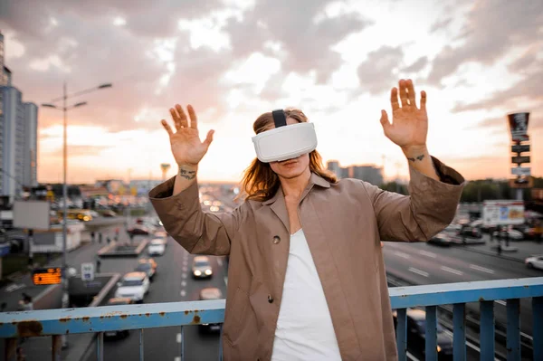 Young and long-haired guy in VR glasses