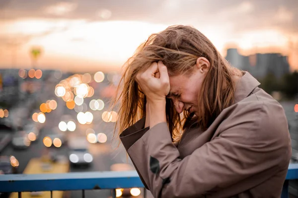 Young redhead guy clenches his fists near face full of pain — Stock Photo, Image