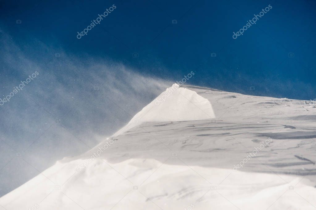 Clear and high mountain snowdrift under the sky