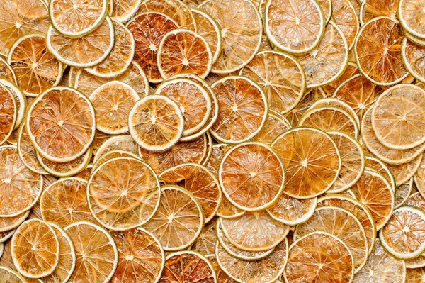 Vista superior de uma grande quantidade de fatias frescas e saborosas de frutas de limão — Fotografia de Stock