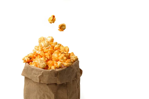 2 large grains of delicious popcorn in a craft pack fly up — Stock Photo, Image