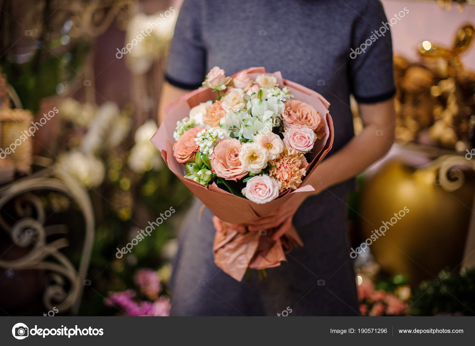Colourful Flower Arrangement Wrapped in Brown Paper Stock Photo