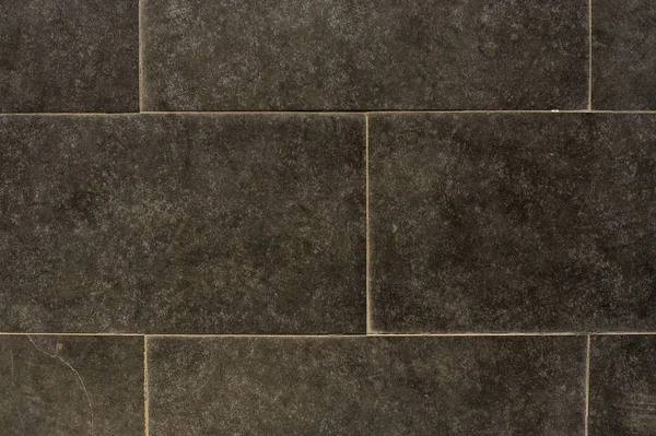 Close up photo of deep grey tiled marble wall — Stock Photo, Image