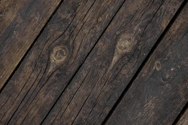 Close up texture background of old dark wooden boards obliquely arranged in a floor — Stock Photo, Image