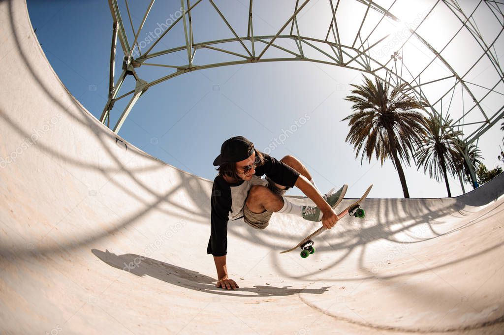 Guy doing stunts on a skate board