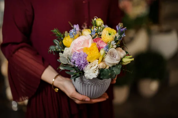Close shot of small bouquet in textured pot — Stock Photo, Image