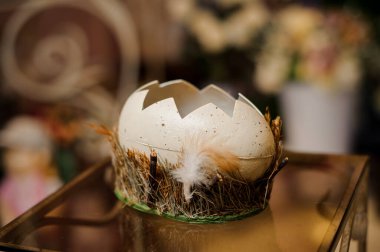 Figure of cracked easter egg on glass table