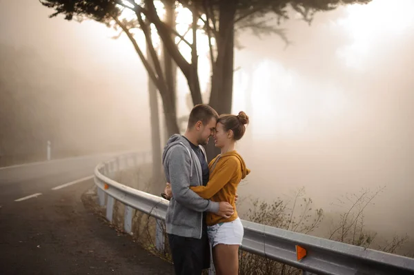 Lovely couple hugging each other in forest — Φωτογραφία Αρχείου