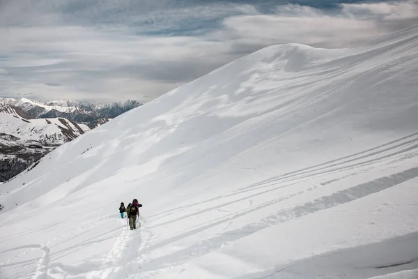 View at hikers travelling on mountain slope — Stok fotoğraf