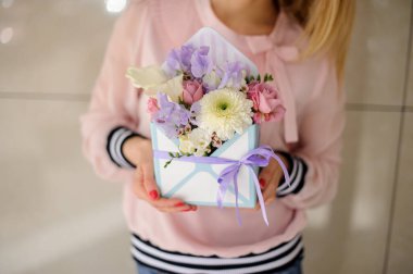 Beautiful composition with different flowers in decorative box.
