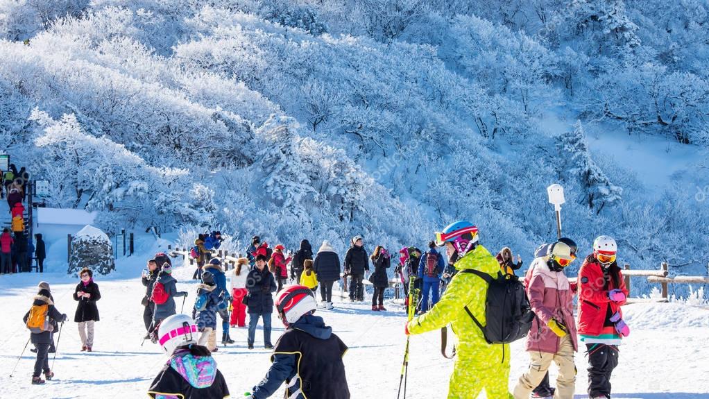 Tourists taking photos of the beautiful scenery and skiing around Deogyusan,South Korea
