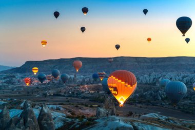 CAPPADOCIA, TURKEY - OCT 19, 2019 : Colorful hot air balloon flying over Cappadocia, Turkey.