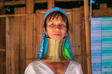 CHIANG RAI, THAILAND - FEB 14, 2020 : Long Neck Karen woman smiling at hill tribe villages, Chiang Rai Province, Thailand. clipart