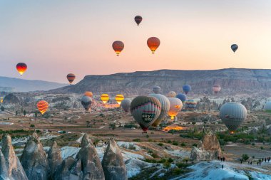 CAPPADOCIA, TURKEY - OCT 19, 2019 : Colorful hot air balloon flying over Cappadocia, Turkey.