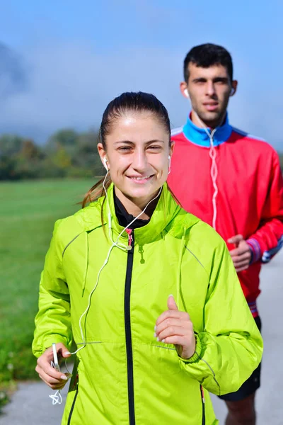 Young couple running on summer morning — Stock Photo, Image