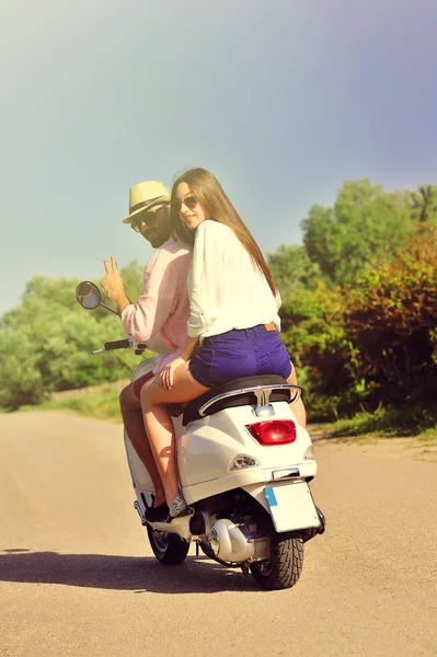 Couple riding on motorbike — Stock Photo, Image