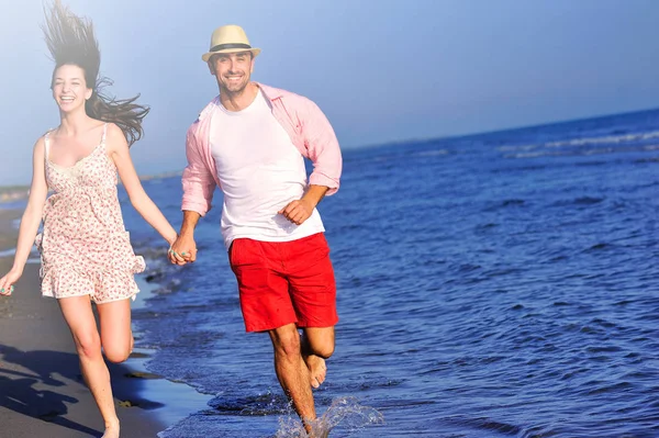 Couple walking on sea shore