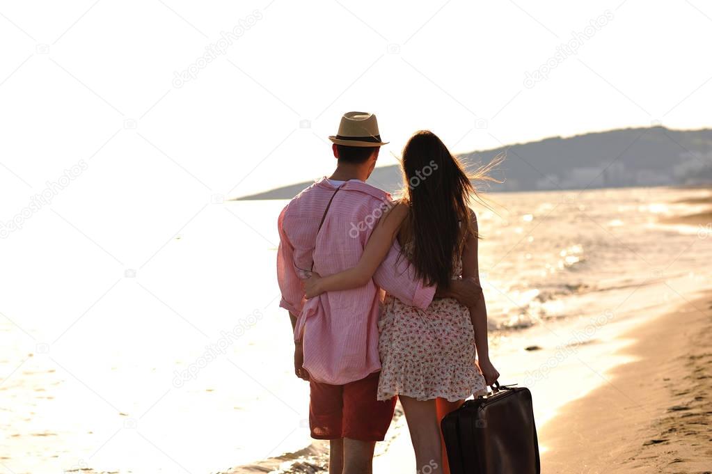 Couple walking on sea shore