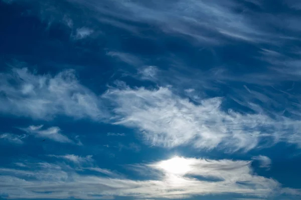 White fluffy clouds on a blue sky — Stock Photo, Image